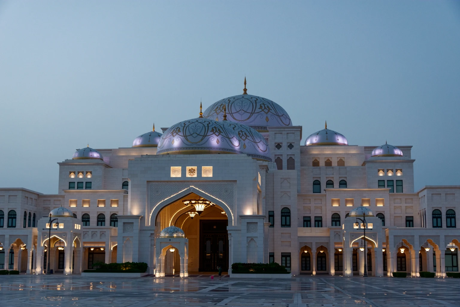 Qasr Al Watan, the presidential palace in Abu Dhabi, its white domes lit at dusk