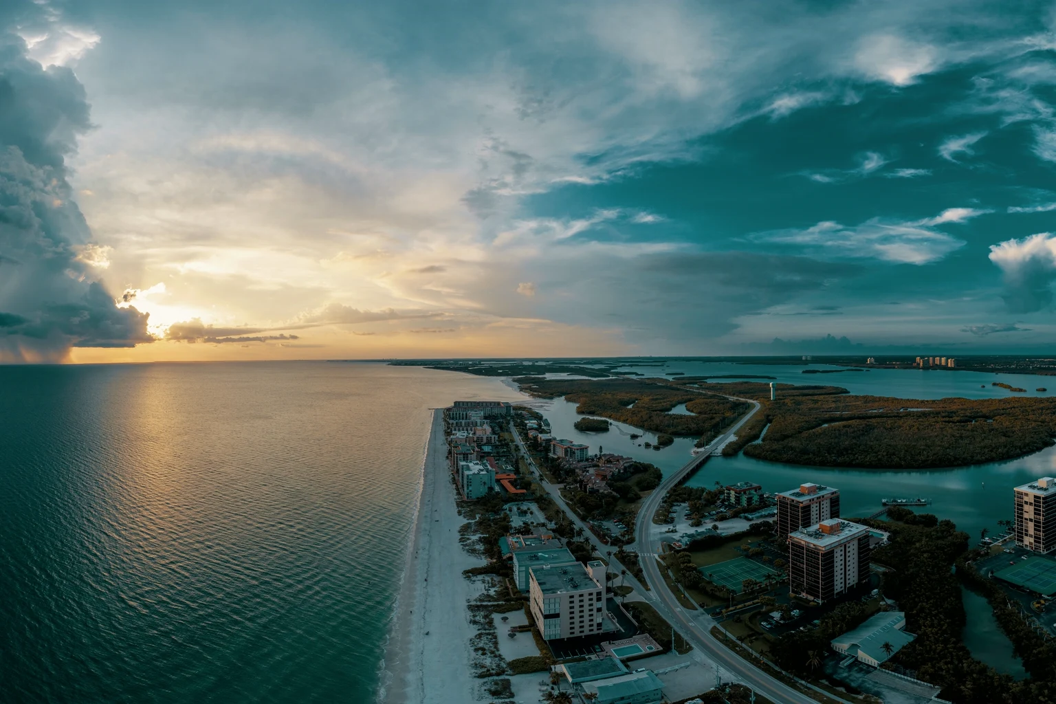 A Florida barrier island and the Gulf at sunset from the air