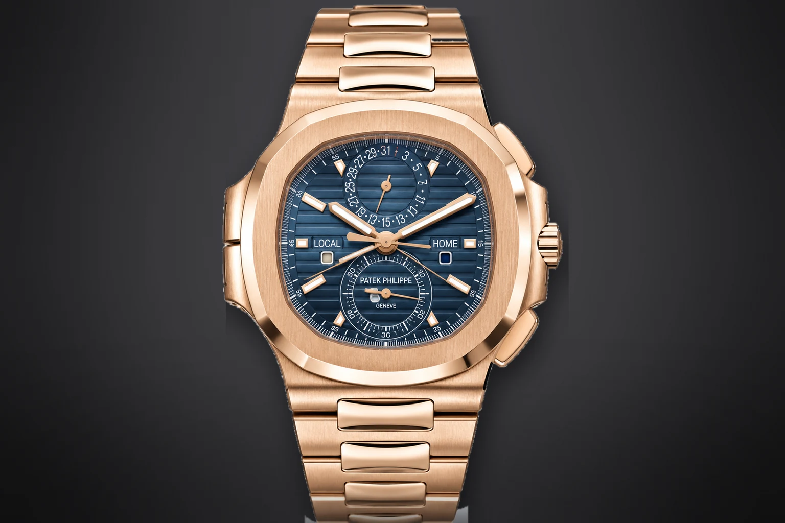 A rose gold Patek Philippe Nautilus Travel Time Chronograph with a blue embossed dial and an integrated rose gold bracelet, lit against a dark ground