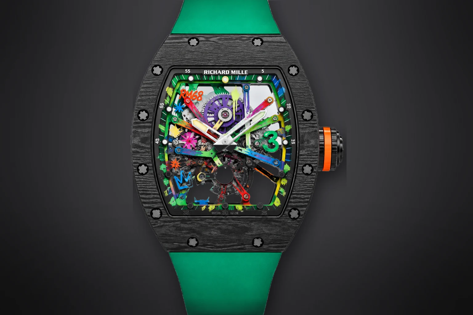 A black carbon Richard Mille RM 68-01 with a skeletonised movement painted in graffiti colours and a green rubber strap, lit against a dark ground
