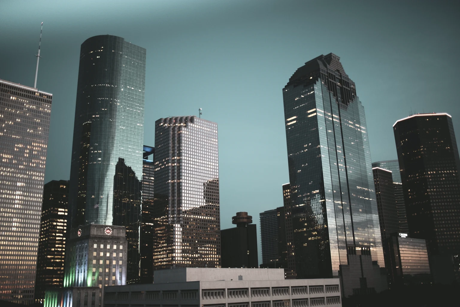 Houston City Hall and the downtown towers at dusk, Heritage Plaza on the right