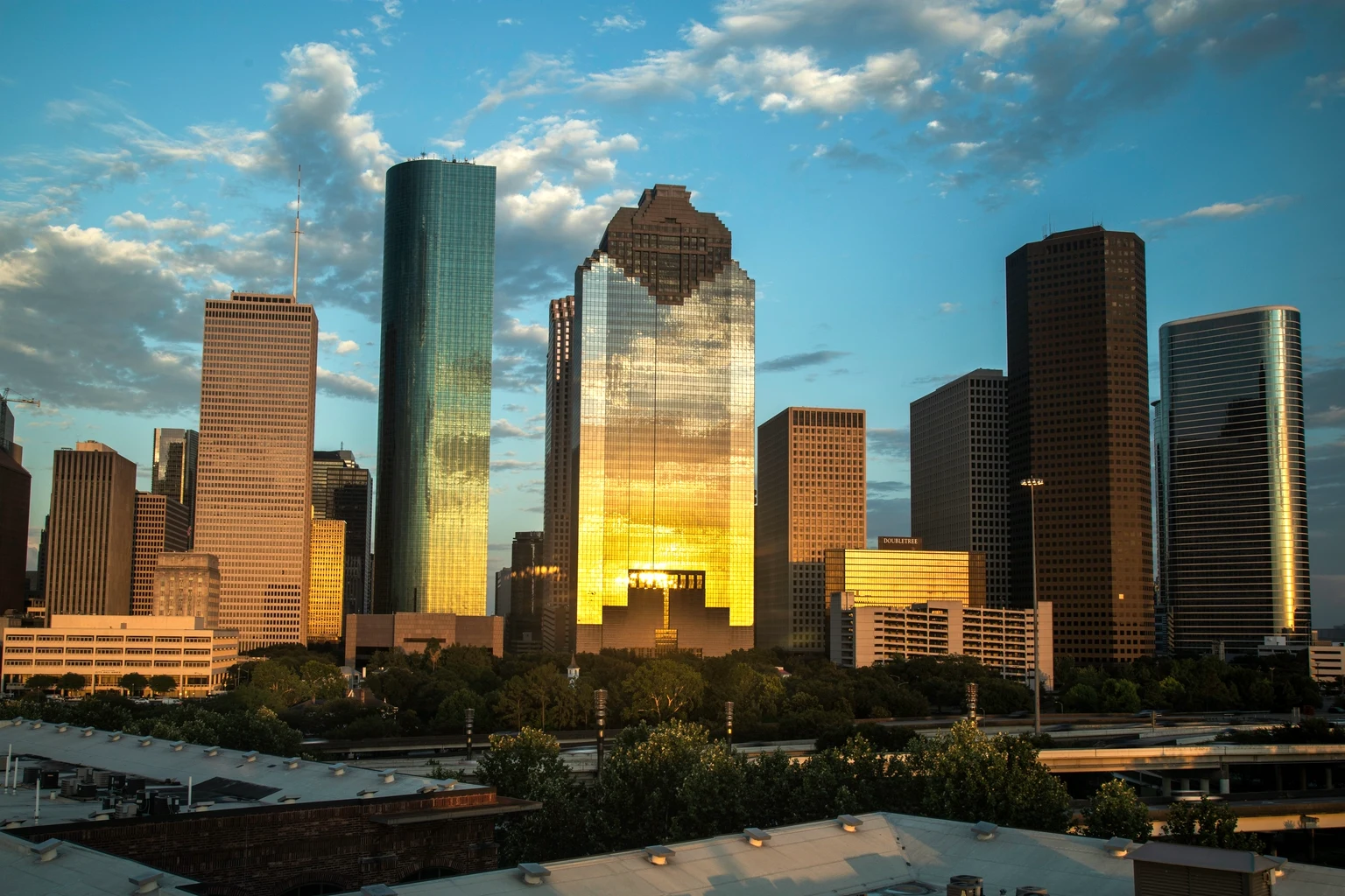 The downtown Houston skyline at sunset, Heritage Plaza lit gold