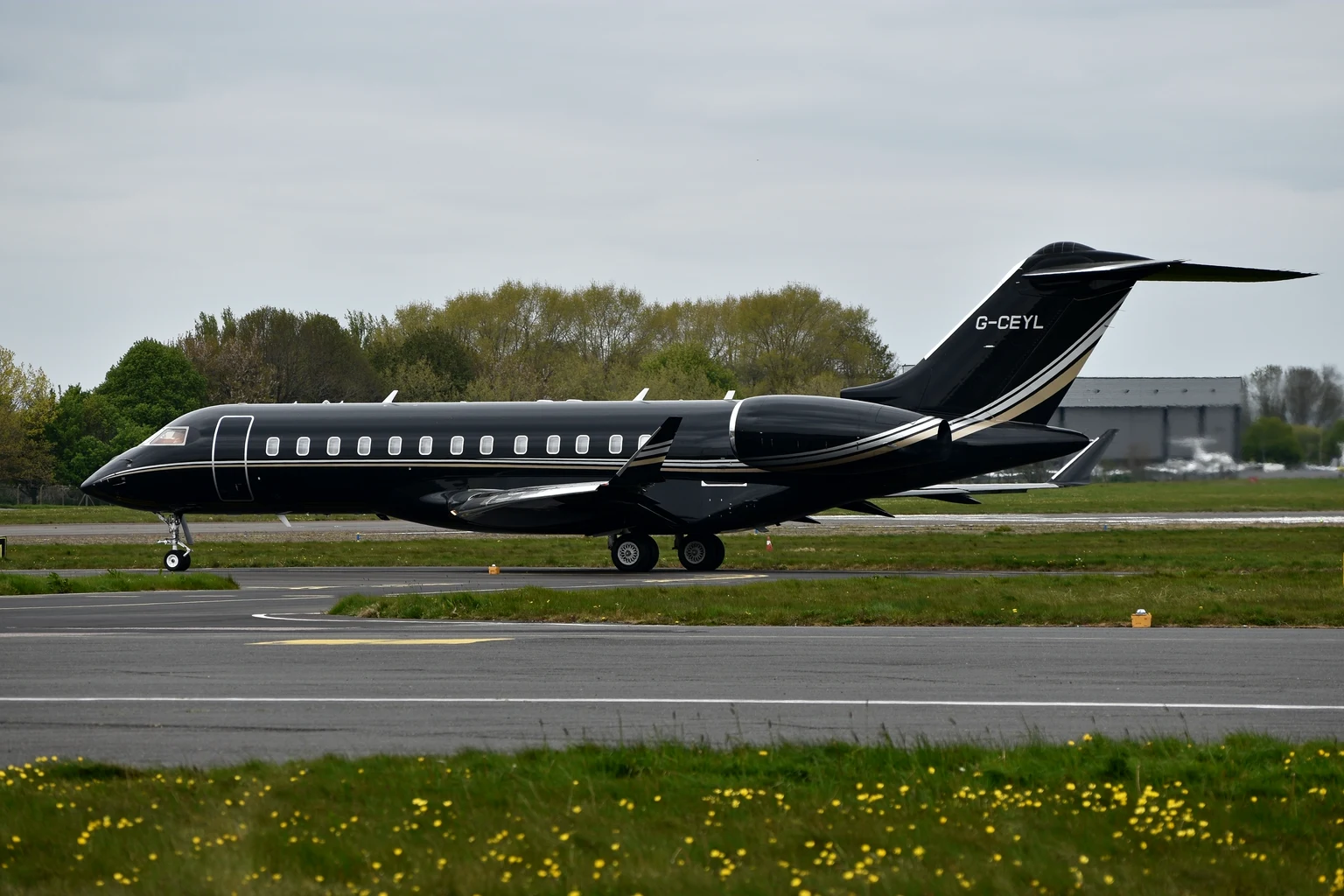 A black Bombardier Global Express taxiing at London Biggin Hill