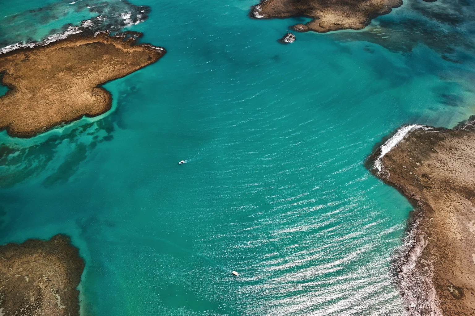 Bahamian islands and sandbars in turquoise water, seen from the air