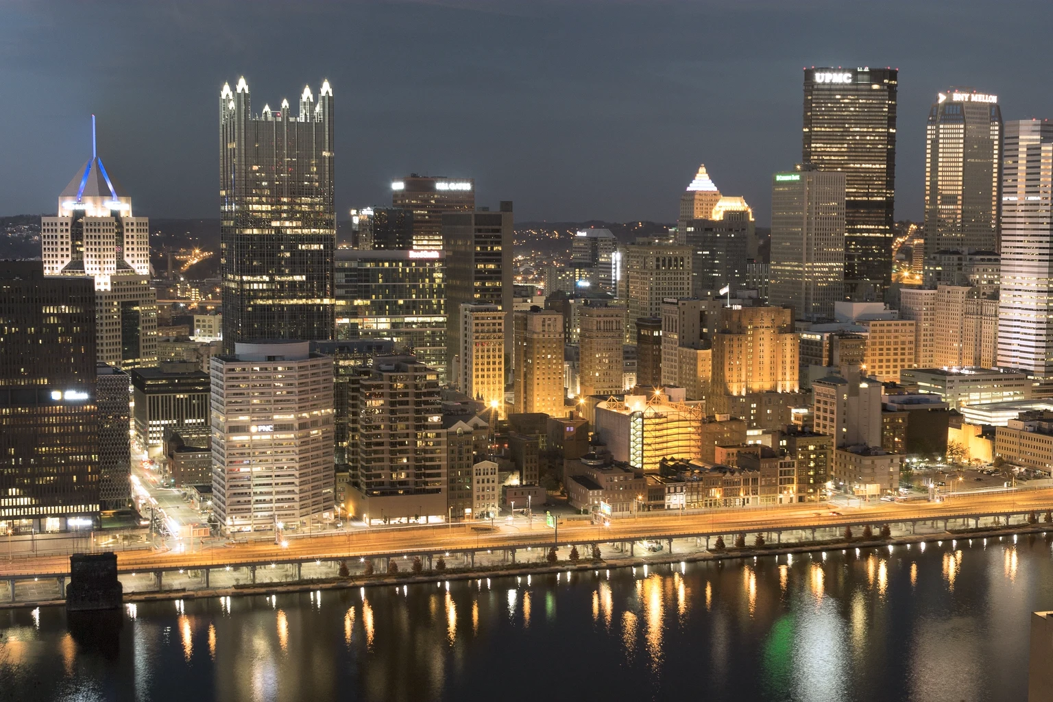 Downtown Pittsburgh from Mount Washington at dusk, PPG Place's glass spires lit above the Monongahela River