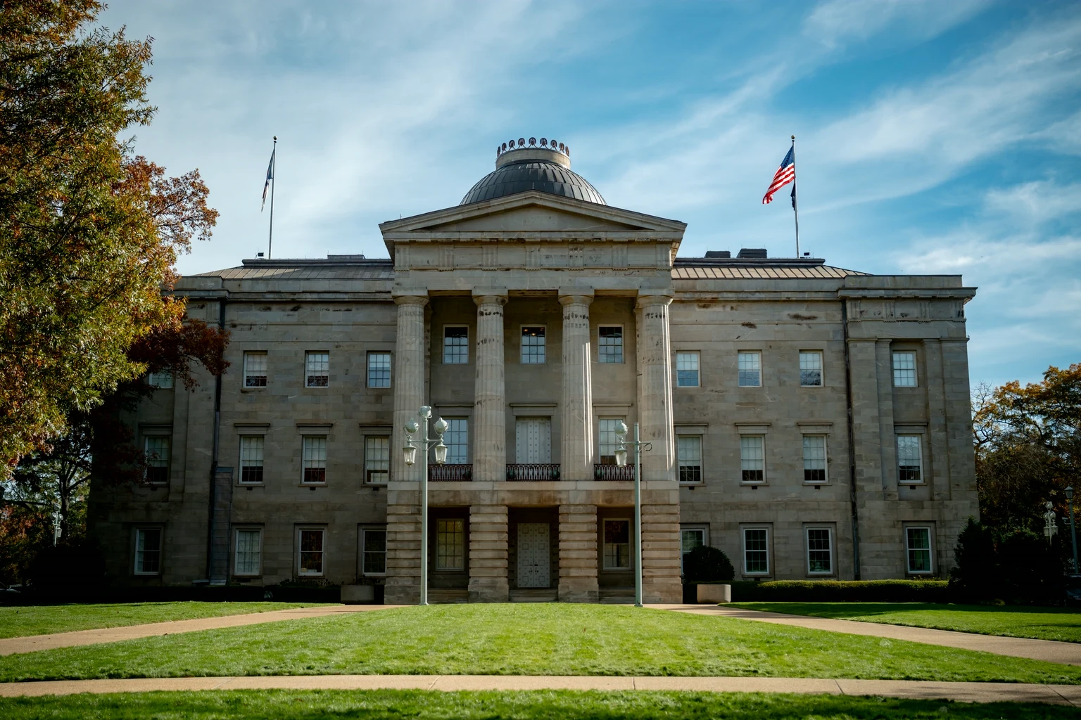 The North Carolina State Capitol in Raleigh under a clear autumn sky