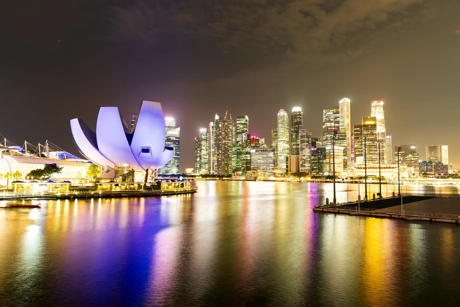 The ArtScience Museum and the Singapore skyline across Marina Bay at night