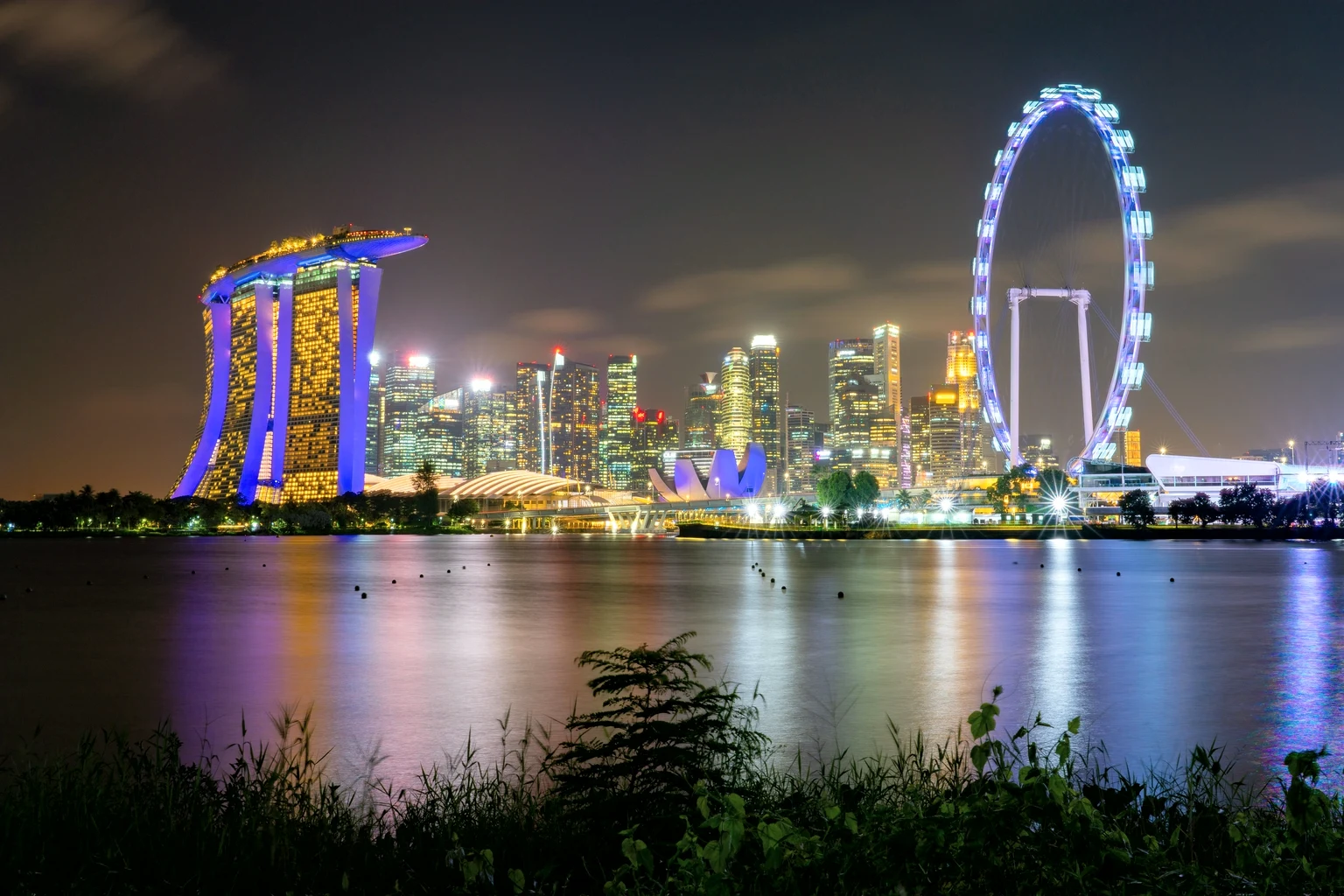 Marina Bay Sands and the Singapore Flyer lit at night