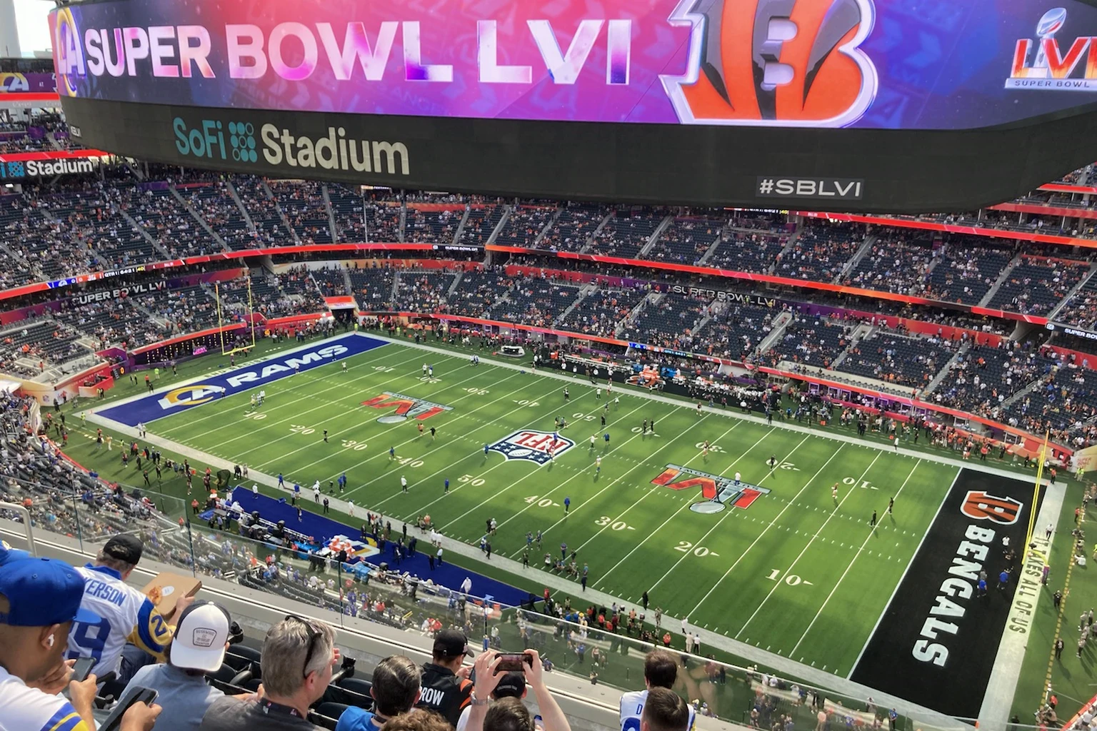 Super Bowl LVI at SoFi Stadium: the stands filling before kick-off, the game's name on the screen above the field