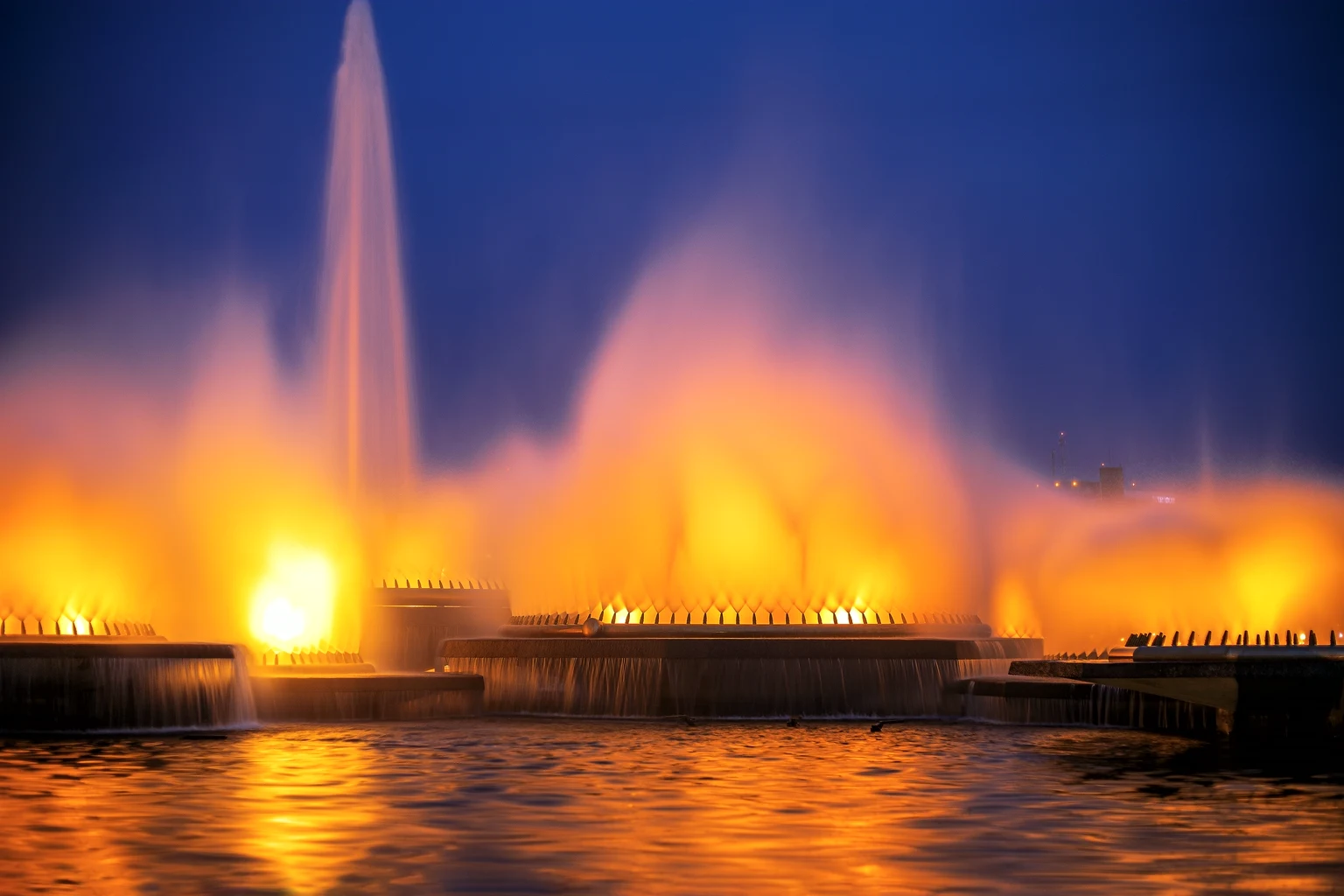 The Bellagio fountains lit gold against the evening sky