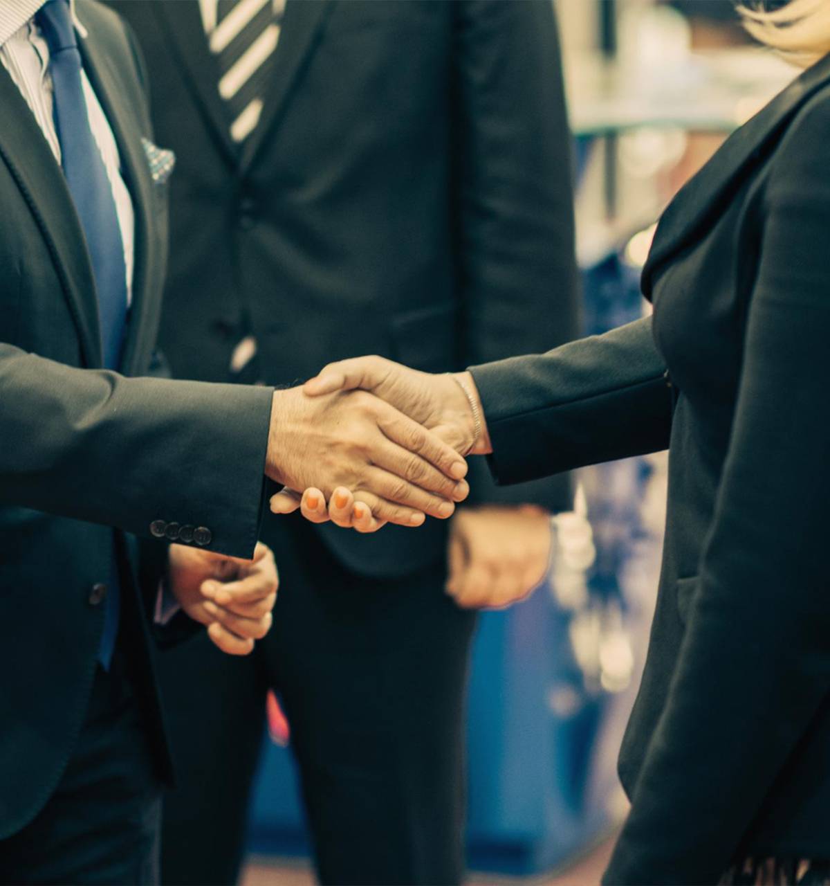 A group of suppliers shaking hands.