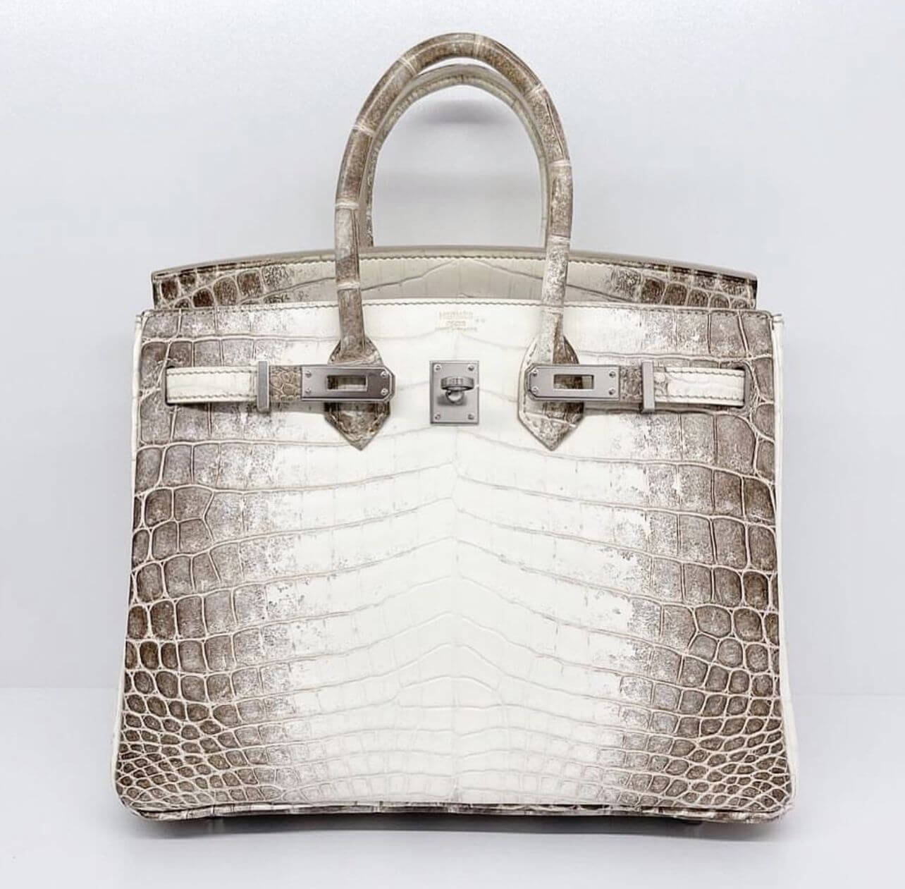 Personal Shopping for a white crocodile skin Hermes Birkin bag.